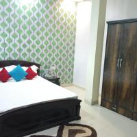 Super Deluxe room with patterned accent wall and wardrobe