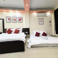 Triple room with twin beds, AC, and warm bedside lighting